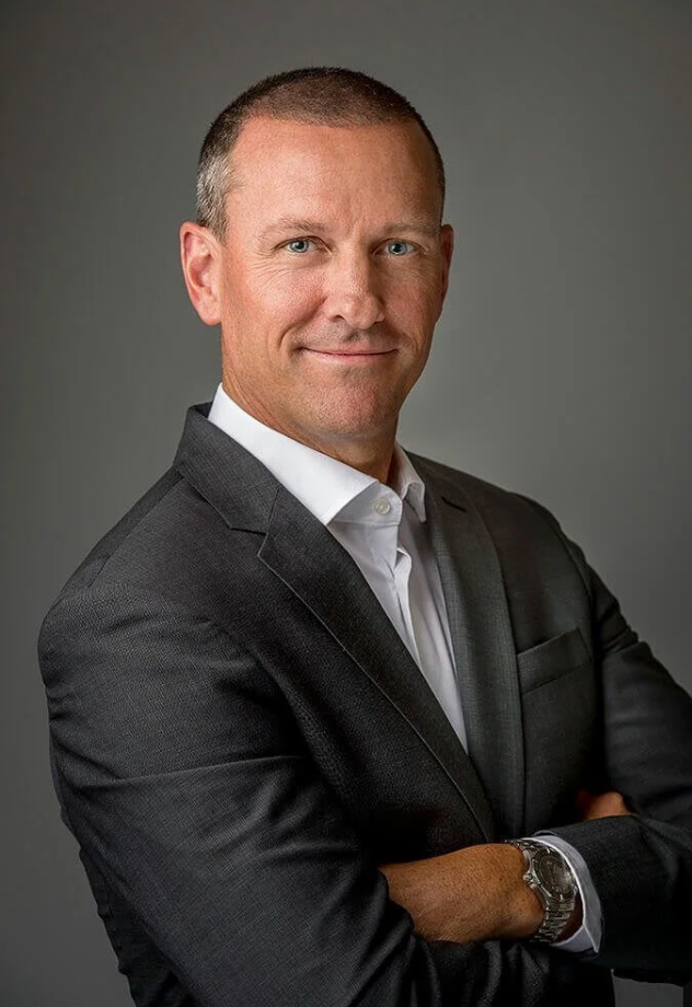 Illustrative professional portrait. The displayed name is an example, not an identification of the person pictured.